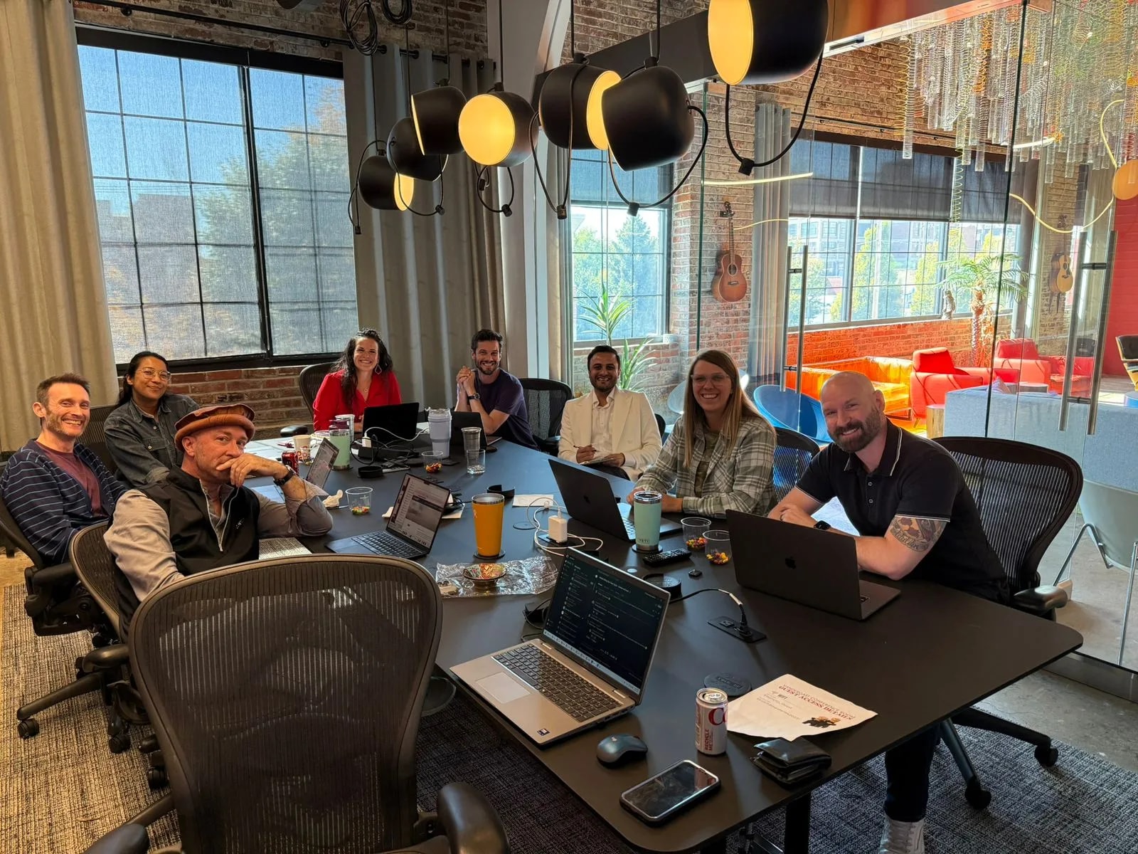 Software Pro Digital team collaborating around the conference table at the office