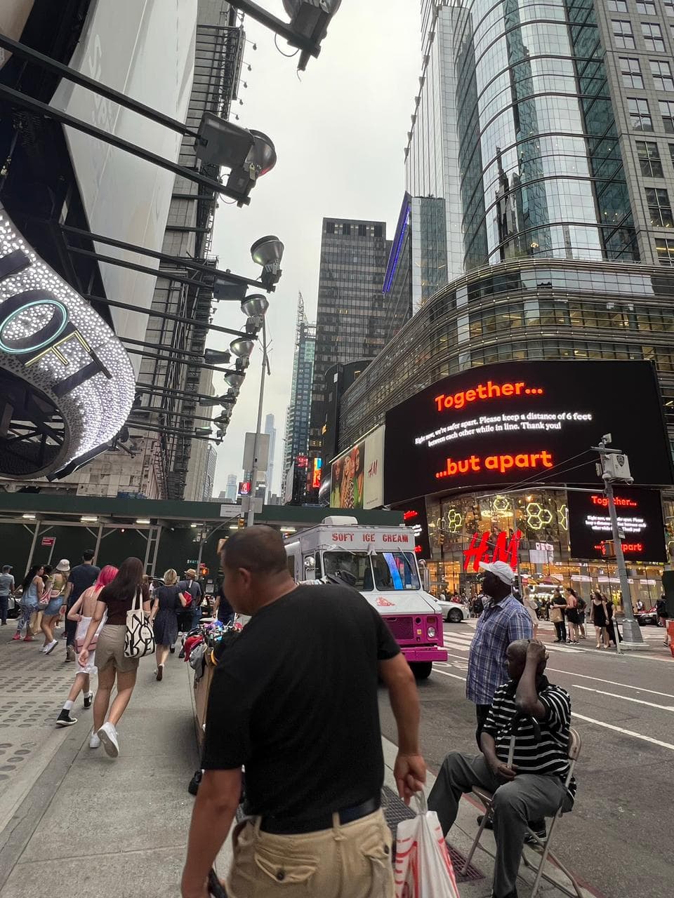 Crowds and illuminated billboards in Times Square, New York City